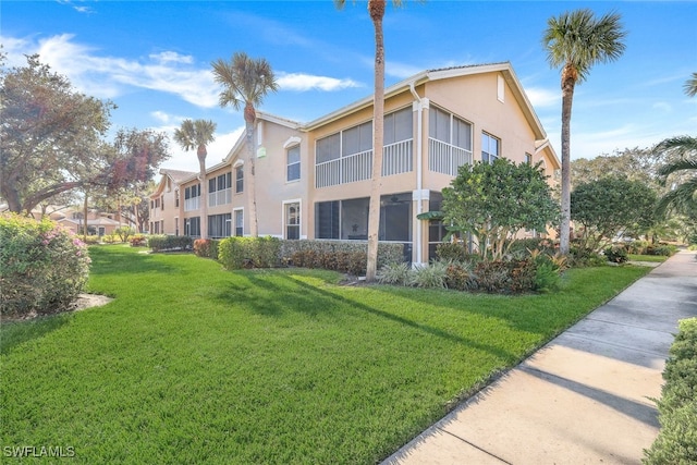 view of property exterior featuring a lawn