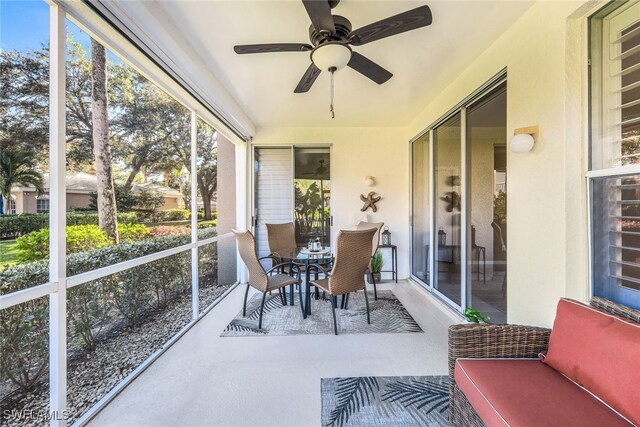 sunroom / solarium with ceiling fan