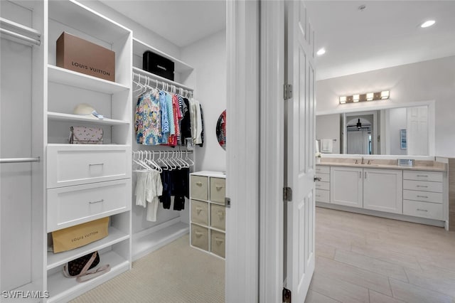 spacious closet featuring sink