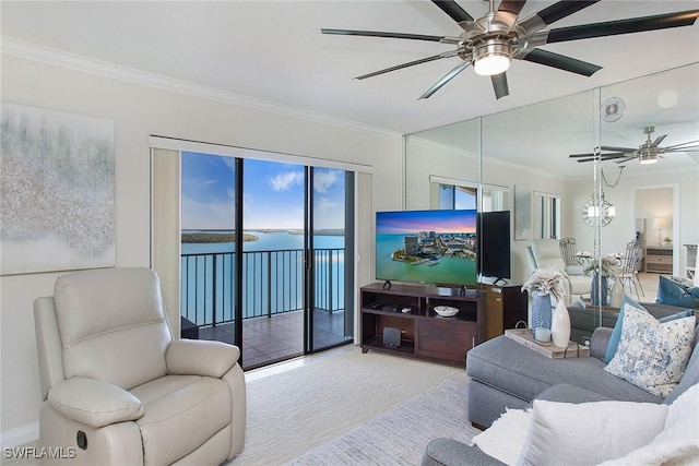 carpeted living room with ceiling fan with notable chandelier and crown molding