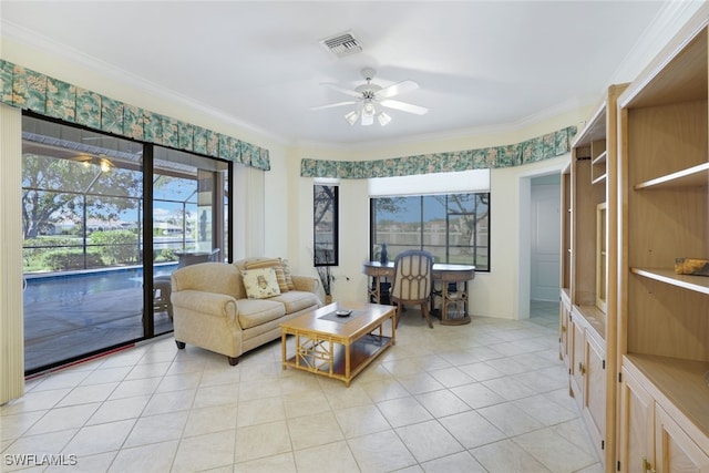 tiled living room featuring ceiling fan and ornamental molding