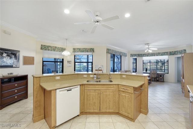 kitchen with dishwasher, sink, a kitchen island with sink, and crown molding