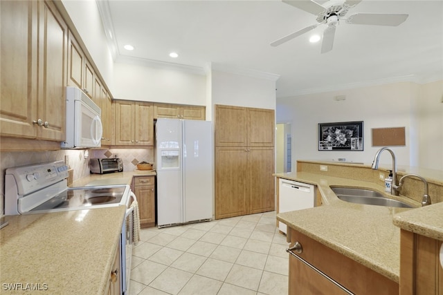 kitchen featuring crown molding, sink, ceiling fan, and white appliances