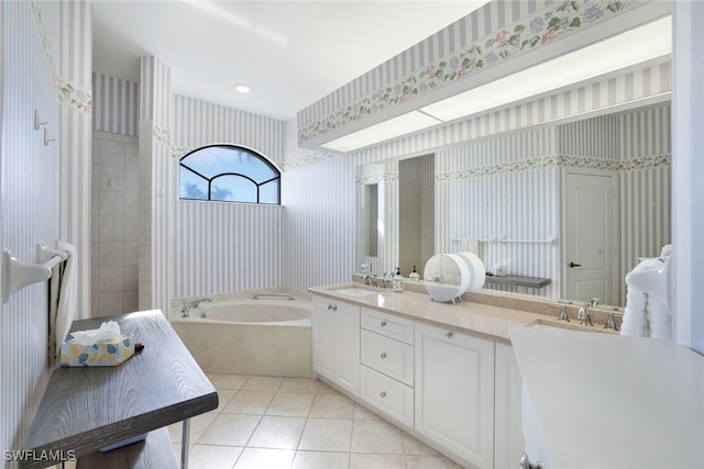 bathroom featuring vanity, tile patterned floors, and a bathing tub