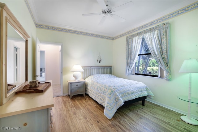 bedroom featuring ceiling fan, crown molding, and light wood-type flooring