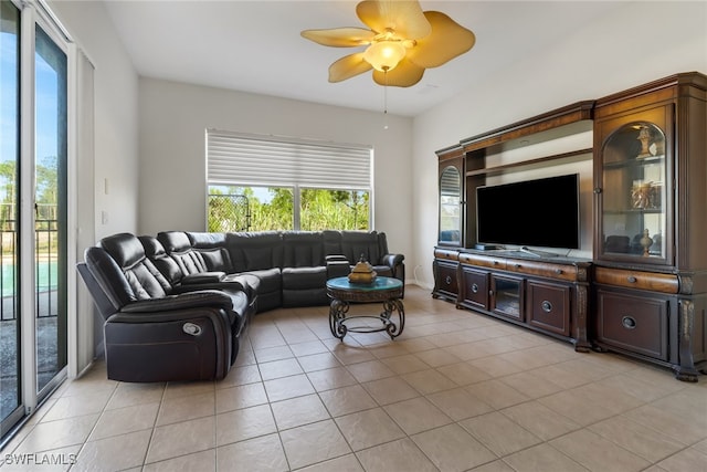 tiled living room featuring ceiling fan