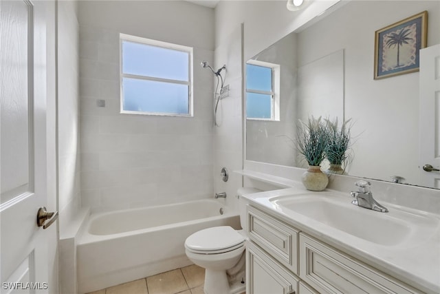 full bathroom with tile patterned floors, vanity, toilet, and tiled shower / bath combo