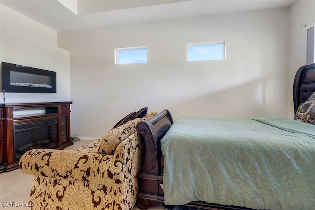 bedroom with light tile patterned floors