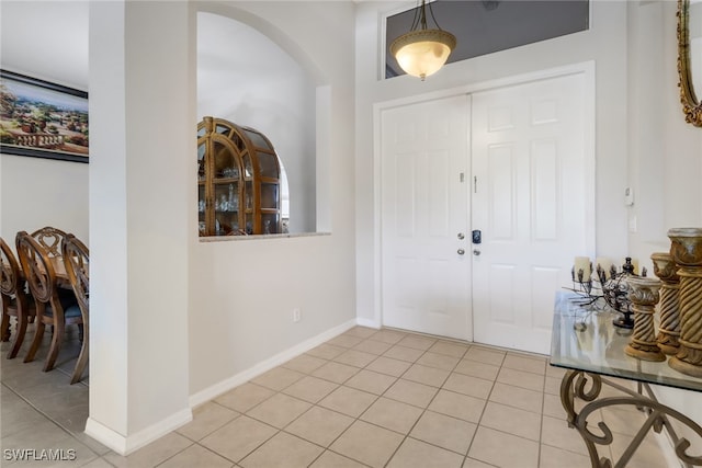 foyer entrance featuring light tile patterned flooring