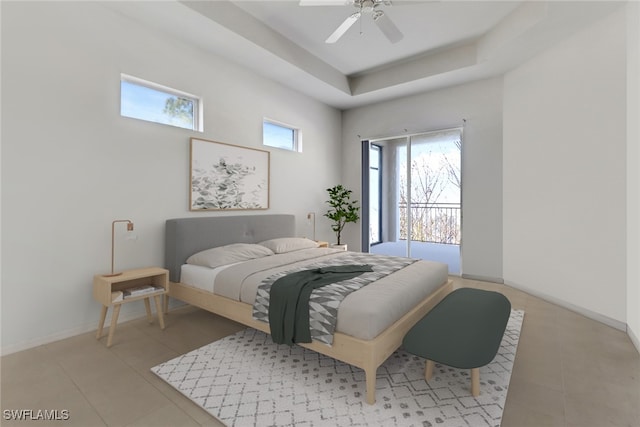 bedroom featuring a tray ceiling, access to exterior, ceiling fan, and light tile patterned floors