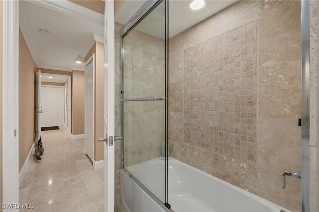 bathroom with ornamental molding and bath / shower combo with glass door