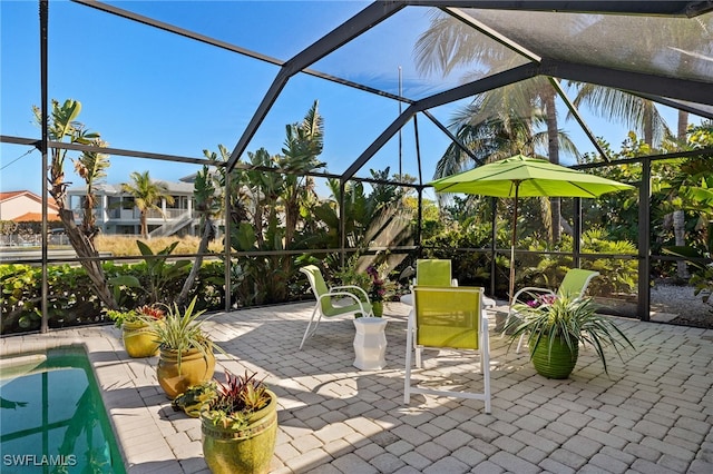 view of patio with glass enclosure