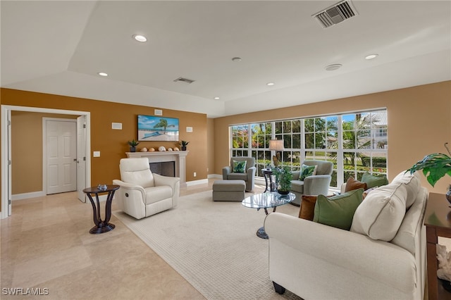 living room featuring a wealth of natural light and vaulted ceiling