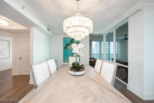 7515 Pelican Bay Blvd Unit 14A, Naples, FL 34108 - dining space featuring wood finished floors, crown molding, baseboards, and a chandelier