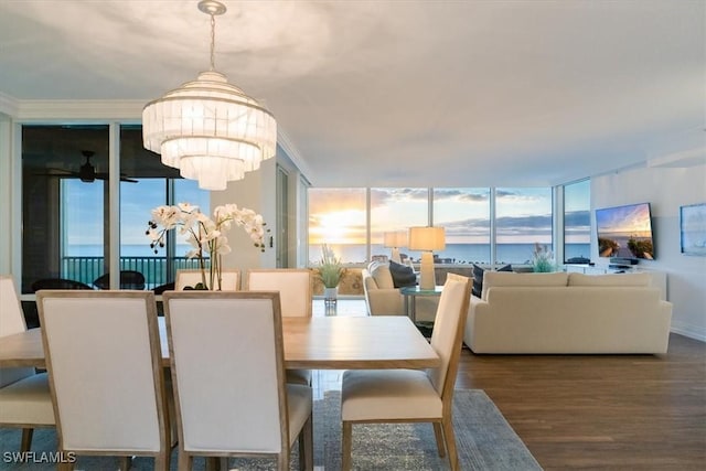 7515 Pelican Bay Blvd Unit 14A, Naples, FL 34108 - dining area featuring plenty of natural light, wood finished floors, a chandelier, and a wall of windows