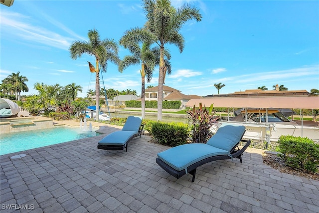 view of patio featuring a pool with hot tub