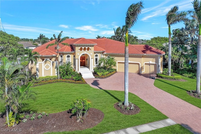 mediterranean / spanish-style home featuring a front lawn