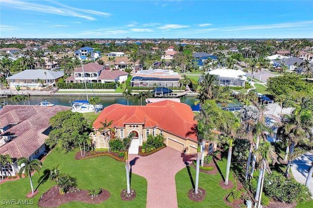 birds eye view of property featuring a water view