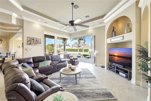 living room with ceiling fan, light tile patterned flooring, and ornamental molding