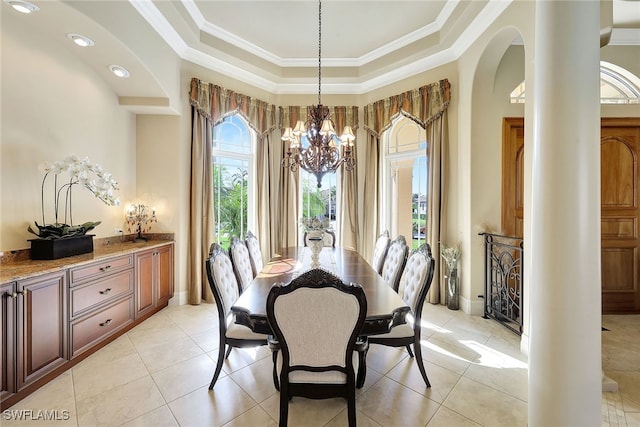 dining room featuring crown molding, a healthy amount of sunlight, and a notable chandelier