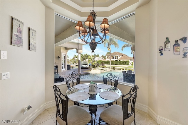 tiled dining area with an inviting chandelier