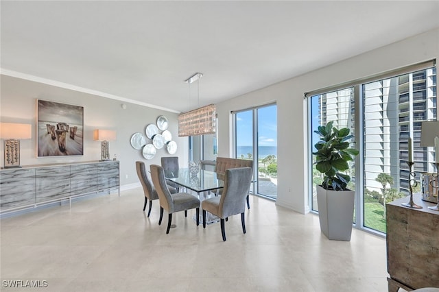 dining area featuring crown molding