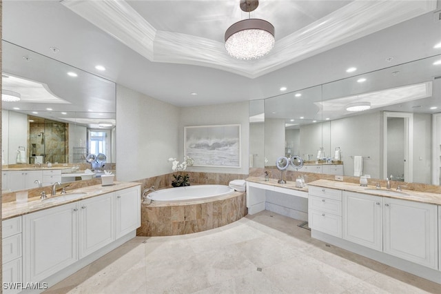 bathroom featuring vanity, crown molding, and a tray ceiling