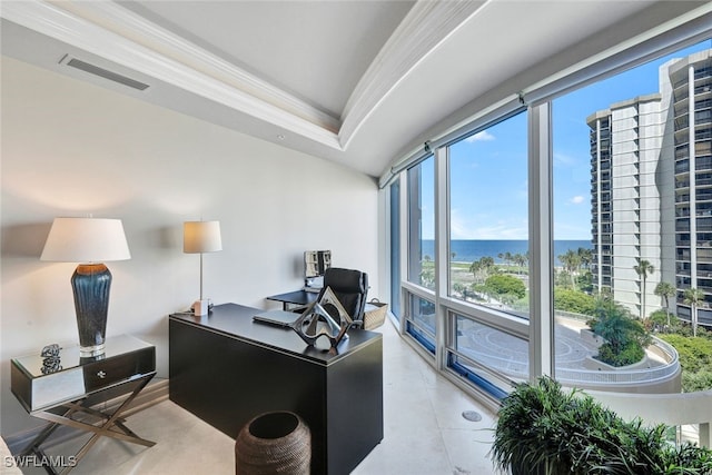 office featuring a water view, light tile patterned floors, and ornamental molding