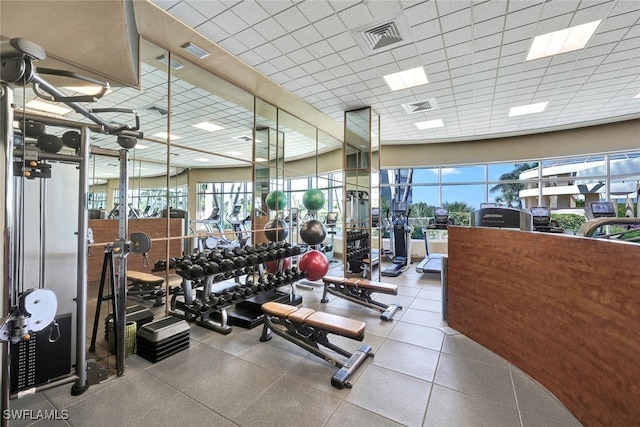 workout area featuring a drop ceiling