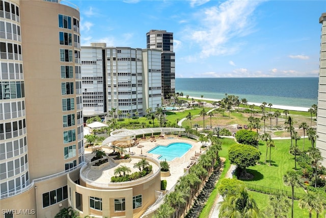 view of pool featuring a beach view and a water view