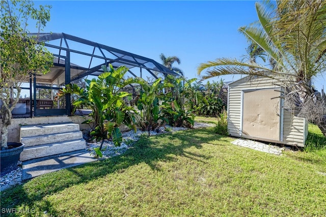 view of yard featuring a lanai and a storage shed