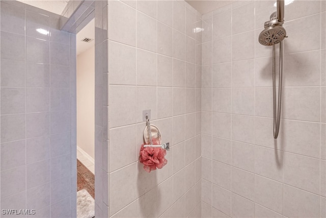 bathroom with tiled shower