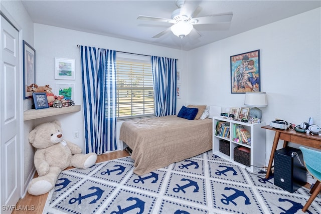 bedroom with hardwood / wood-style flooring and ceiling fan