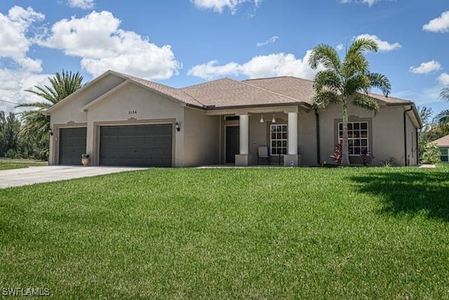 single story home with a front yard and a garage