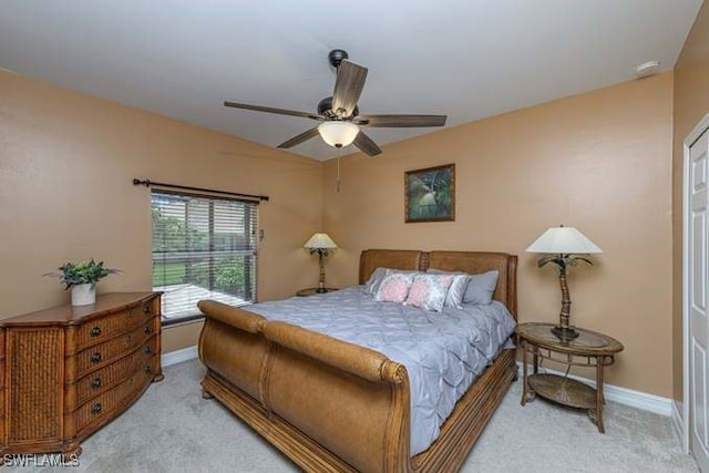 bedroom with light carpet and ceiling fan