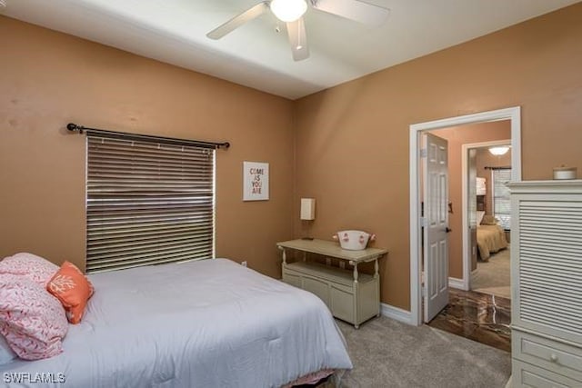 bedroom with ceiling fan and light carpet