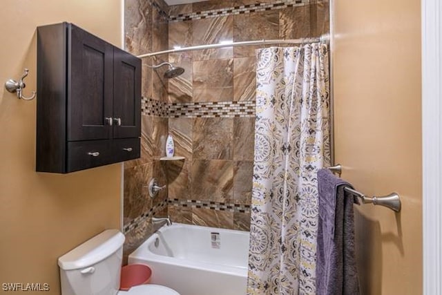 bathroom with toilet and shower / bath combo with shower curtain