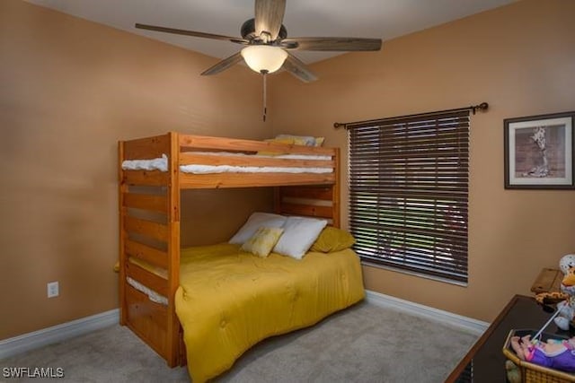 bedroom featuring ceiling fan and light colored carpet