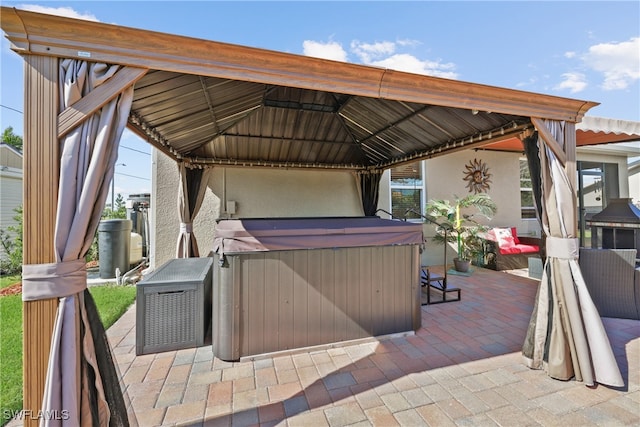 view of patio with a gazebo and a hot tub