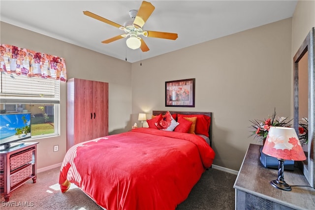 bedroom featuring dark colored carpet and ceiling fan