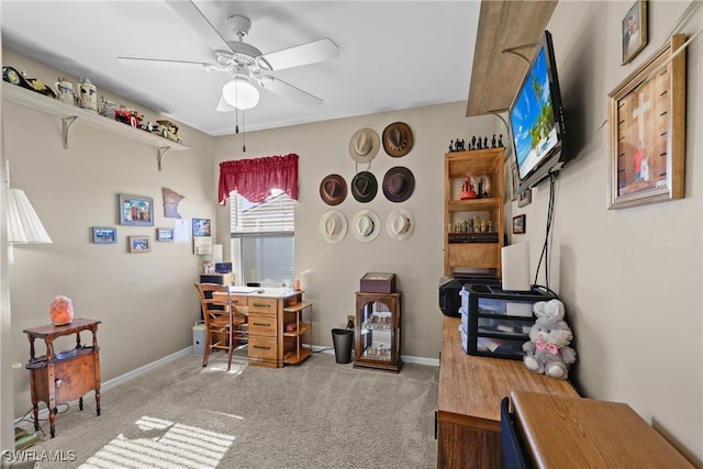 carpeted office space with ceiling fan