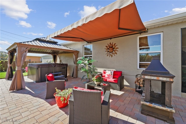 view of patio with a gazebo and a hot tub