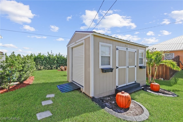 view of outdoor structure with a yard