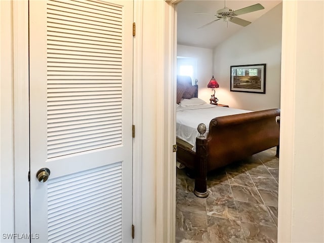 bedroom with ceiling fan and lofted ceiling