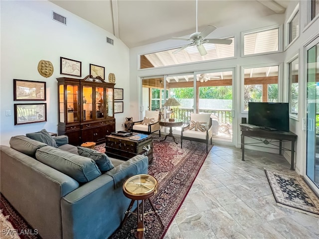 interior space featuring ceiling fan and lofted ceiling