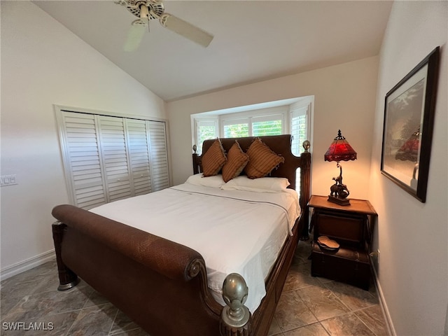 bedroom featuring ceiling fan, a closet, and vaulted ceiling