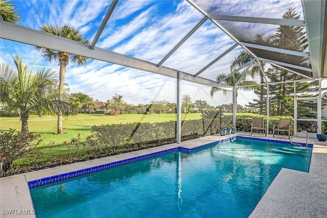 view of pool with a patio area and a lanai