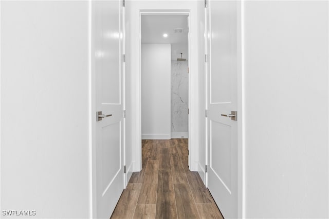 hallway featuring dark wood-type flooring