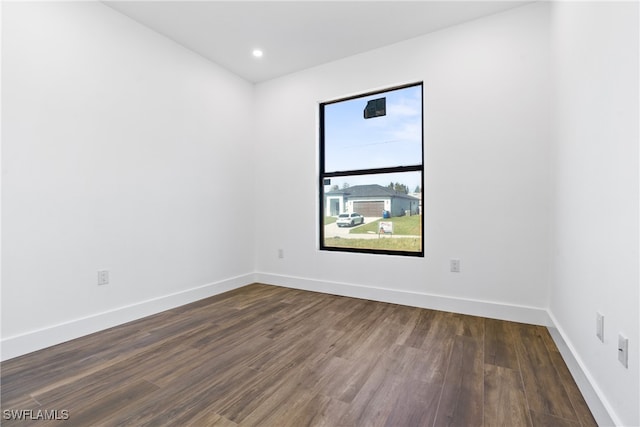 empty room featuring dark wood-type flooring