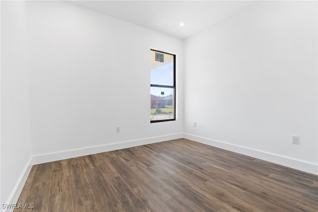 empty room featuring dark wood-type flooring